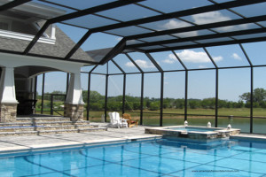 Screen pool enclosure with lake in background