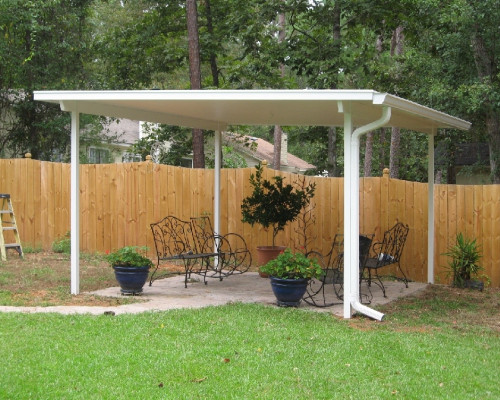 Gazebo like roofing in backyard with potted plants and chairs