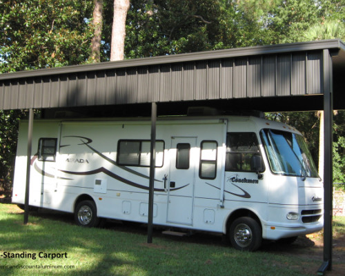 Free standing carport with an RV parked underneath